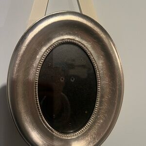 Pottery Barn silver oval frame with hanging ribbon
